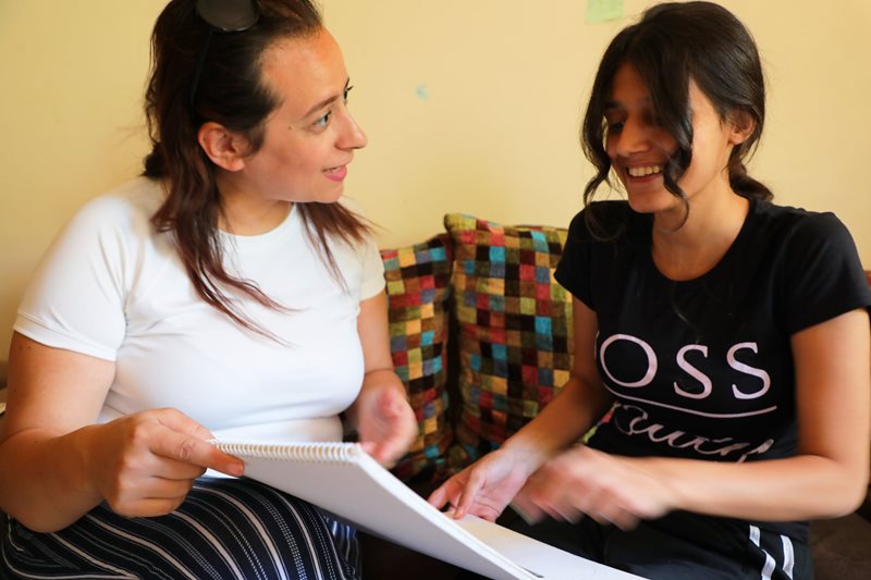 Sabah showing her drawings to Ramia