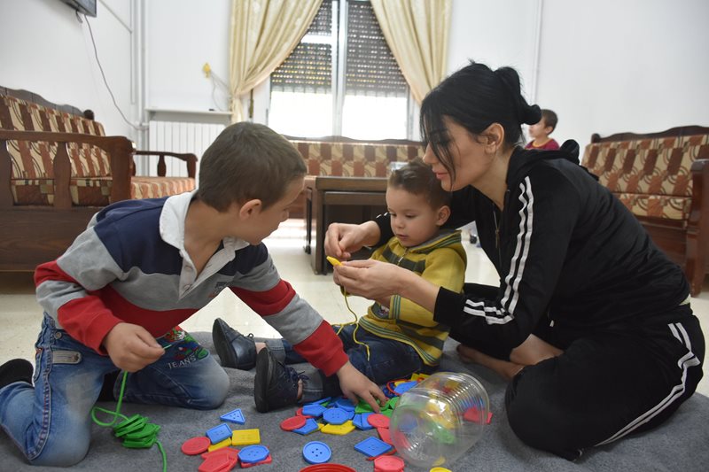 Ammar playing at SOS small group home