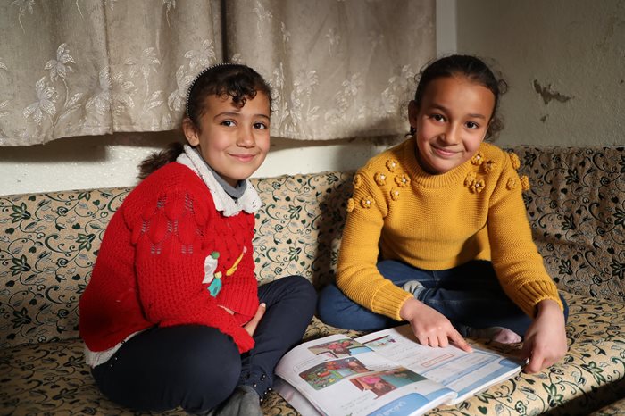 Nadine doing her homework with Mais